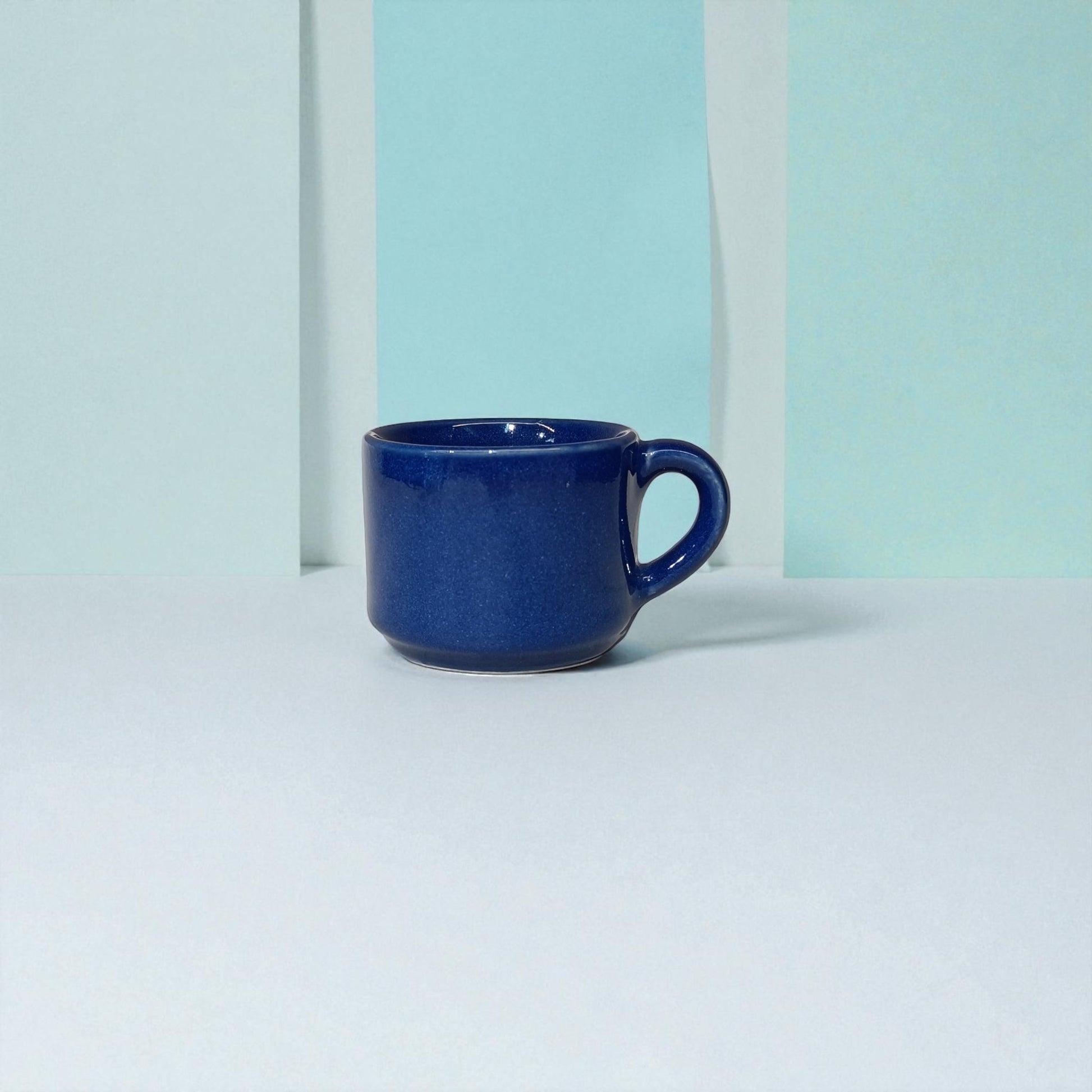 Blue mug on a light blue background